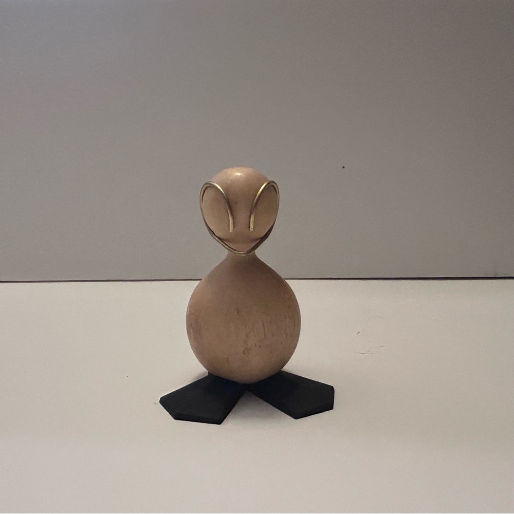 Gold Figurine with Black Base